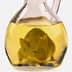 A mouse submerged in a glass bottle filled with yellow liquid, resembling oil. - Olive Oil Times