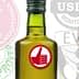 Glass bottle of olive oil featuring certification seals including USDA and California Olive Oil. - Olive Oil Times