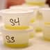 Small plastic containers labeled S3 and S4 filled with olive oil samples. - Olive Oil Times