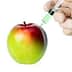 A red and green apple being injected with a syringe containing a green liquid. - Olive Oil Times
