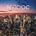Aerial view of New York City skyline during sunset with vibrant colors in the sky. - Olive Oil Times