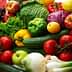 A variety of fresh vegetables and fruits including peppers, tomatoes, cucumbers, and leafy greens. - Olive Oil Times