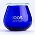 Blue glass container with the logo of The International Olive Oil School printed on it. - Olive Oil Times