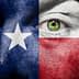 Close-up of a face painted with the Texas flag colors, featuring a green eye. - Olive Oil Times