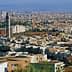 A panoramic view of Oujda, Morocco, featuring various buildings and structures in the landscape. - Olive Oil Times