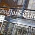 Entrance sign of The New York Times building with the name displayed prominently. - Olive Oil Times