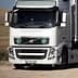 White Volvo truck with Nargourmet branding and green circular symbols on the front. - Olive Oil Times
