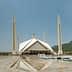 Faisal Mosque in Islamabad with four tall minarets and a large triangular roof structure. - Olive Oil Times