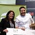 Chef holding an award while posing with a woman at a gastronomy event. - Olive Oil Times