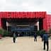 Entrance of the Metropolitan Exhibition Center with a large red sign above the doors. - Olive Oil Times