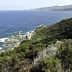 Coastal view featuring rocky shoreline and vegetation along the water's edge. - Olive Oil Times