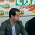Three men seated at a table during a press conference with COAG branding in the background. - Olive Oil Times