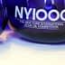 Blue glass awards for the New York International Olive Oil Competition with the text 'NYIOOC'. - Olive Oil Times