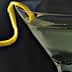 A martini glass filled with a clear liquid and a lemon twist garnish on the rim. - Olive Oil Times