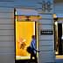 Chanel storefront featuring display windows with mannequins and branding. - Olive Oil Times