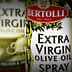 Three bottles of Bertolli Extra Virgin Olive Oil and Olive Oil Spray with distinct labels and designs. - Olive Oil Times