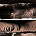 Close-up view of several blocks of dark chocolate with textured surfaces. - Olive Oil Times