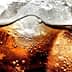 Close-up image of a carbonated beverage with ice cubes and bubbles visible in the liquid. - Olive Oil Times