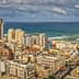 Panoramic view of a coastal city with buildings and the ocean in the background. - Olive Oil Times