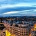 Panoramic view of Madrid's skyline featuring buildings and a twilight sky. - Olive Oil Times