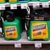 Various containers of Roundup weed killer displayed on a store shelf with price tags. - Olive Oil Times