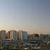 Panoramic view of Tripoli skyline featuring modern buildings and a clear sky. - Olive Oil Times
