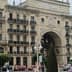 Facade of the Banco Santander building featuring ornate architectural details and balconies. - Olive Oil Times