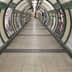 Interior view of a London Underground tunnel featuring artwork on the walls and signage for the Bakerloo Line. - Olive Oil Times