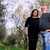 Orjana Hrvatin and Timotej Zupan standing together in an olive grove. - Olive Oil Times