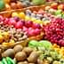 Colorful assortment of fresh fruits and vegetables arranged in baskets at a market. - Olive Oil Times