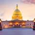 United States Capitol Building illuminated at sunset with a colorful sky in the background. - Olive Oil Times