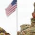 Two military personnel in camouflage uniforms saluting the American flag during a ceremony. - Olive Oil Times