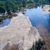 Aerial view of a river featuring sandbanks and surrounding vegetation. - Olive Oil Times