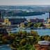 Aerial view of Stockholm showcasing the cityscape, waterways, and greenery in the foreground. - Olive Oil Times