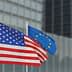 United States flag and European Union flag waving side by side on flagpoles. - Olive Oil Times