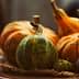 A variety of decorative pumpkins including orange and green ones arranged on a plate with natural fibers. - Olive Oil Times