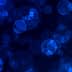 Abstract blue bokeh background with circular shapes and varying sizes. - Olive Oil Times