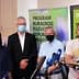 A group of four individuals standing together at a press conference, wearing masks and formal attire. - Olive Oil Times