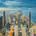 Aerial view of Gold Coast city skyline with high-rise buildings and coastline at dusk. - Olive Oil Times