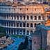 The Colosseum in Rome, an ancient amphitheater, viewed from an elevated perspective during sunset. - Olive Oil Times