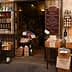 Entrance of an Italian specialty food store with various products displayed outside. - Olive Oil Times