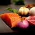 Raw salmon fillet, meat, onion, garlic, egg, and almonds arranged on a dark surface. - Olive Oil Times