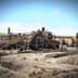 Industrial machinery and equipment at a construction site with various structures and conveyor belts. - Olive Oil Times