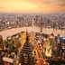 Aerial view of Shanghai's skyline featuring skyscrapers and the Huangpu River during sunset. - Olive Oil Times