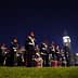 A group of ceremonial guards in uniform standing in formation at night with Big Ben in the background. - Olive Oil Times