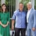 Three individuals standing together for a photo, with one woman in a green dress and two men in casual and formal attire. - Olive Oil Times