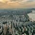 Aerial view of Seoul showing high-rise buildings and the Han River at sunset. - Olive Oil Times