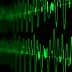 Digital representation of sound waves displayed in green on a dark background. - Olive Oil Times