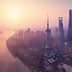Aerial view of Shanghai skyline featuring the Oriental Pearl Tower and skyscrapers during sunset. - Olive Oil Times