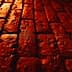 Close-up view of a textured red brick surface with visible imperfections and patterns. - Olive Oil Times